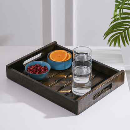 WOOD CURLS rectangular mango wood serving tray with cut-out handles holding glasses of water and bowls of fruit