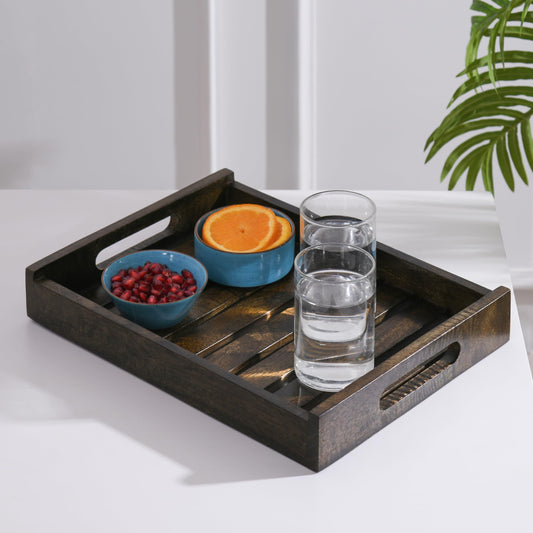 WOOD CURLS rectangular mango wood serving tray with cut-out handles holding glasses of water and bowls of fruit
