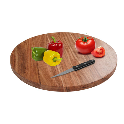 WOOD CURLS round acacia wood chopping board with a knife, red and yellow bell peppers, and a fresh tomato.