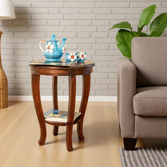 WOOD CURLS Aurora round solid wood side table in mahogany finish with curved legs and a two-tier storage shelf.
