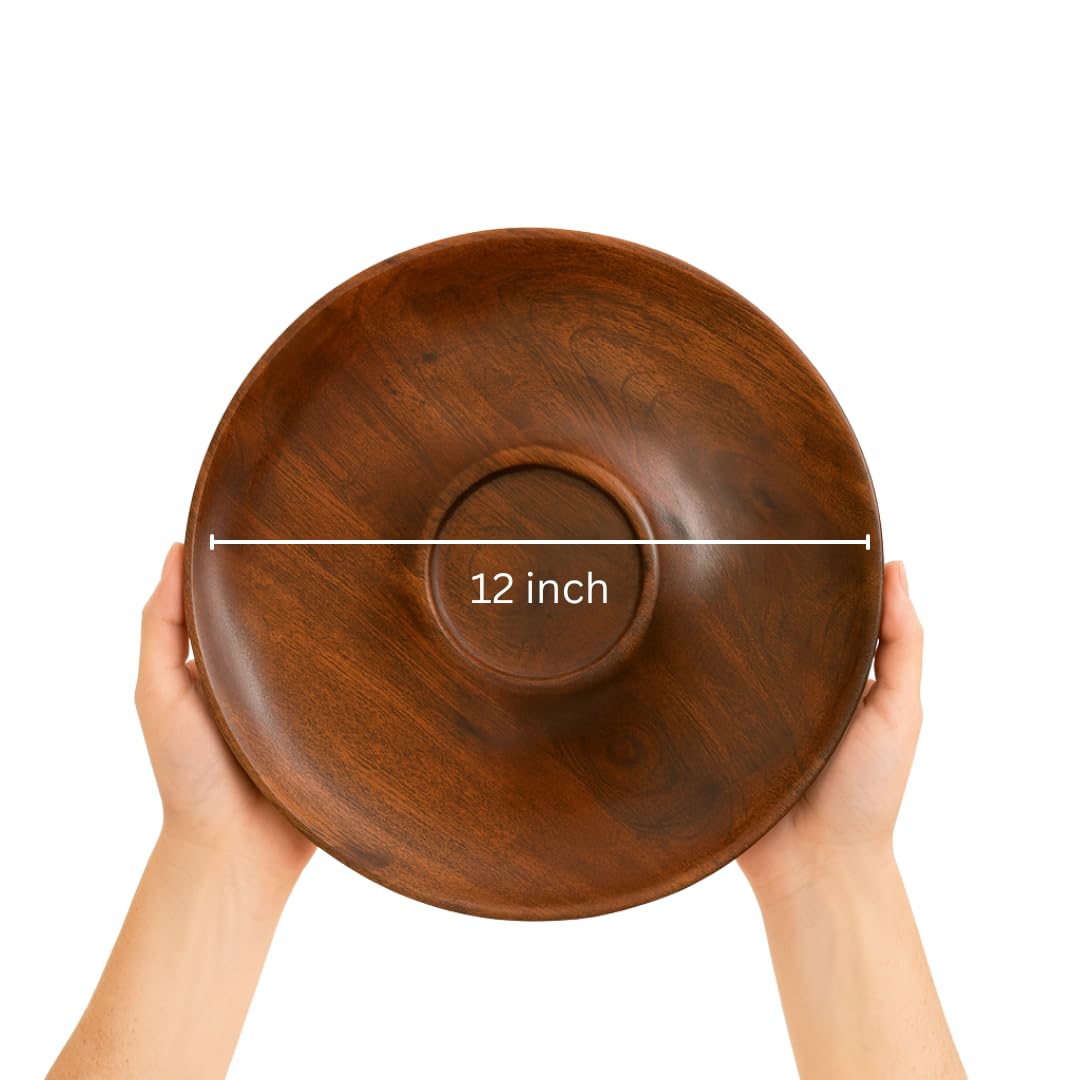 WOOD CURLS handcrafted 12-inch round mango wood chip and dip serving platter held by two hands against white background