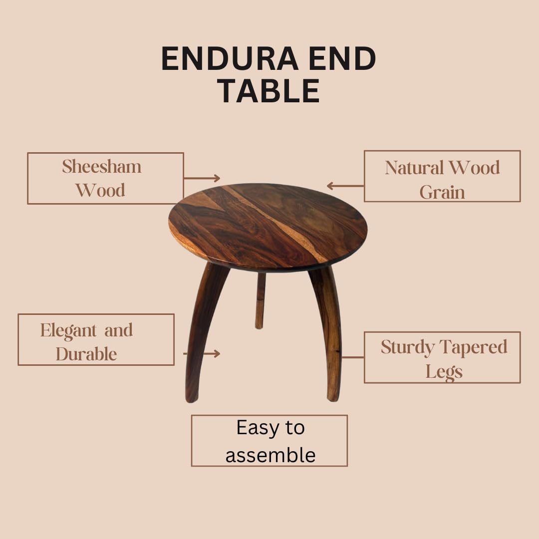 WOOD CURLS Endura round Sheesham wood end table with natural grain and sturdy tapered legs in a studio setting.