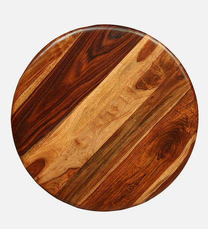 WOOD CURLS round coffee table top made of solid Sheesham wood with a natural grain finish and warm brown tones.