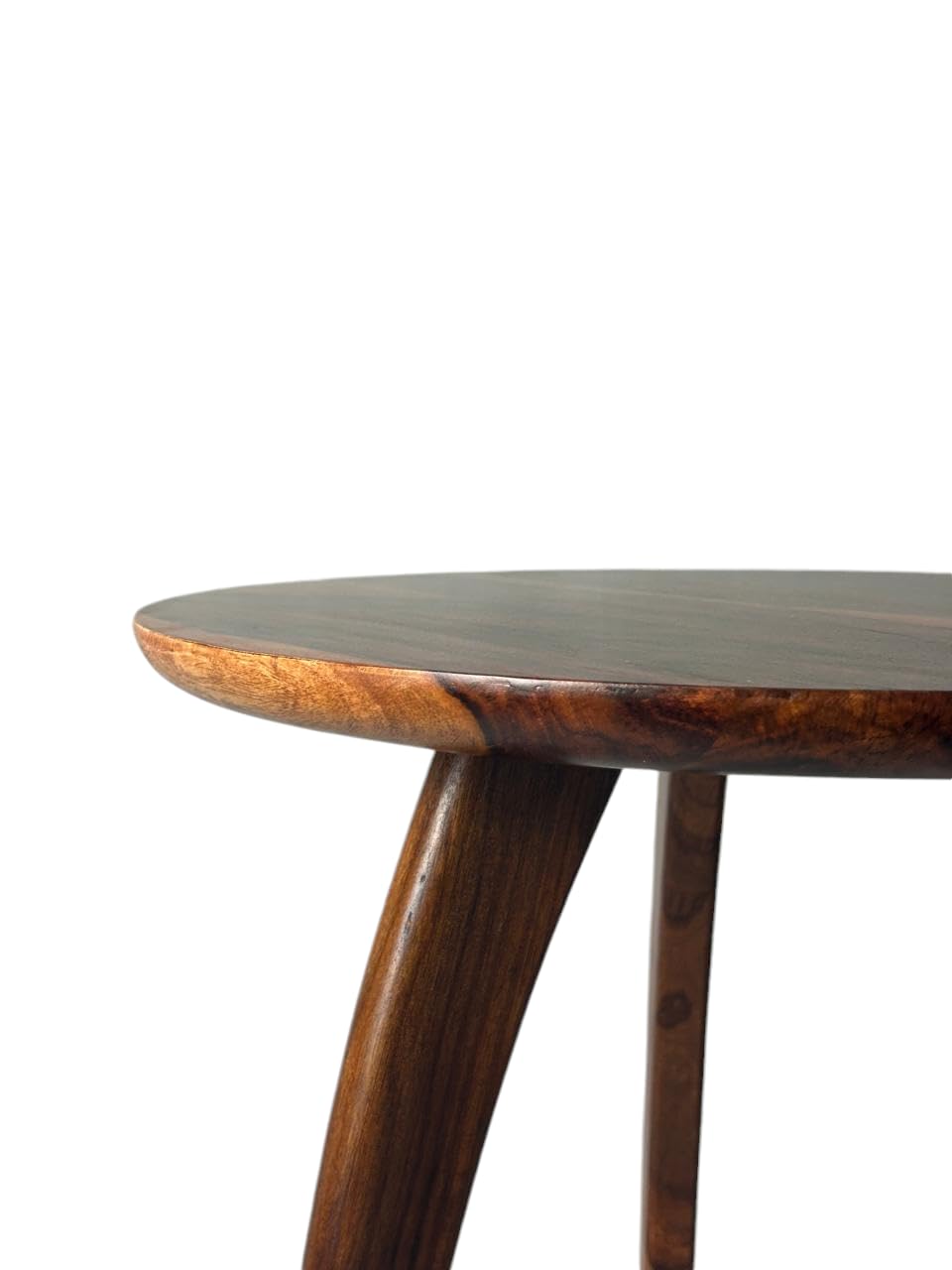 WOOD CURLS round Sheesham wood end table with a rich natural grain finish, showing a close-up of the tabletop and leg.