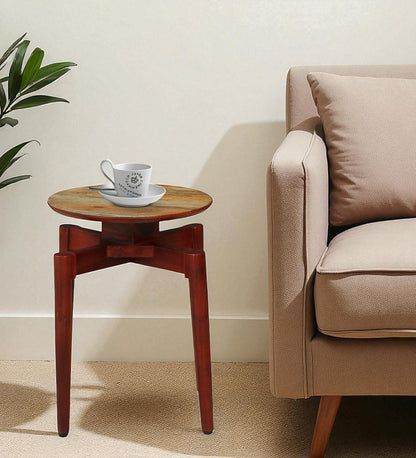 WOOD CURLS round solid wood end table with a coffee cup, placed beside a beige sofa in a modern living room.