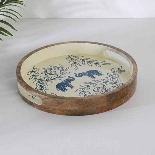 WOOD CURLS round wooden serving tray with hand-painted blue elephant and leaf motifs on a cream background
