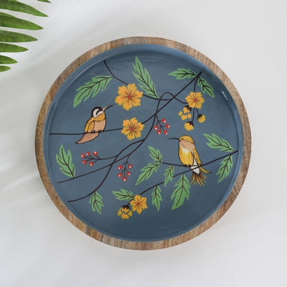 WOOD CURLS round mango wood tray with hand-painted blue background, yellow birds, and floral garden design