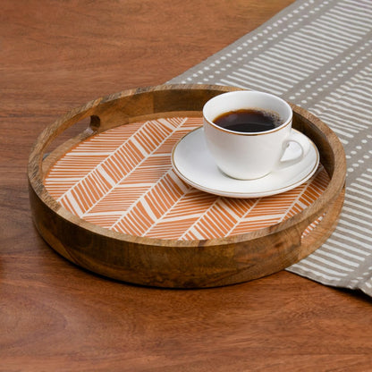 WOOD CURLS round wooden serving tray with a peach geometric herringbone enamel base holding a white coffee cup