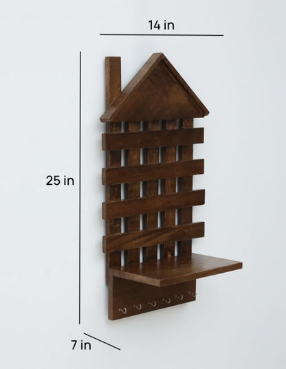 WOOD CURLS rustic brown mango wood wall-mounted key holder with a house-shaped design, shelf, and 6 metal hooks.