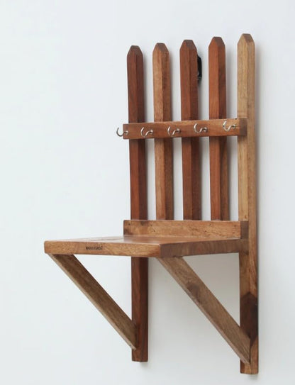 WOOD CURLS rustic Sheesham wood wall-mounted key holder with a fence design and five metal hooks for entryway storage.