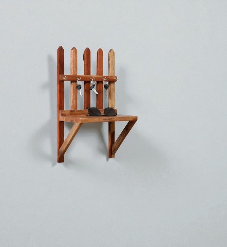 WOOD CURLS rustic Sheesham wood wall-mounted key holder with a fence design, 5 hooks, and a small storage shelf.