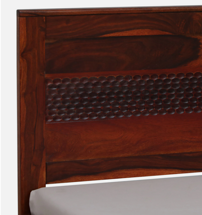 WOOD CURLS single bed headboard in solid Sheesham wood with a rich honey oak finish and decorative carved detailing.