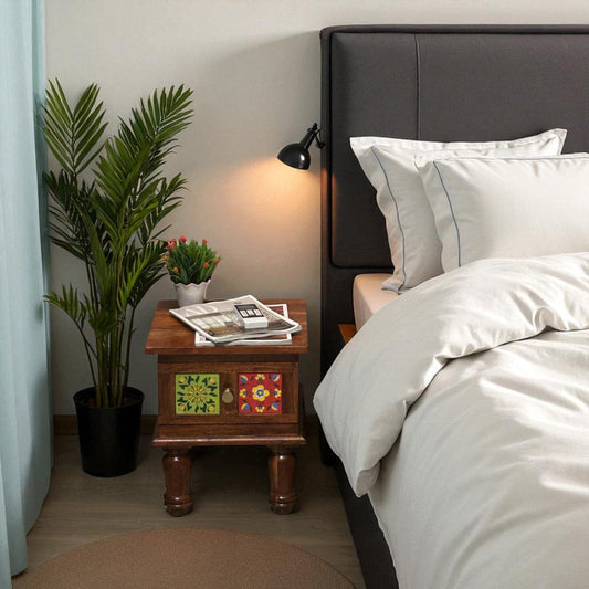 WOOD CURLS handcrafted Sheesham wood bedside table with colorful floral ceramic tile inlay and a storage drawer.