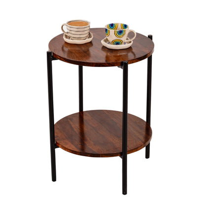 WOOD CURLS round Serenity Sheesham wood coffee table with two tiers and black metal legs, topped with two tea cups.
