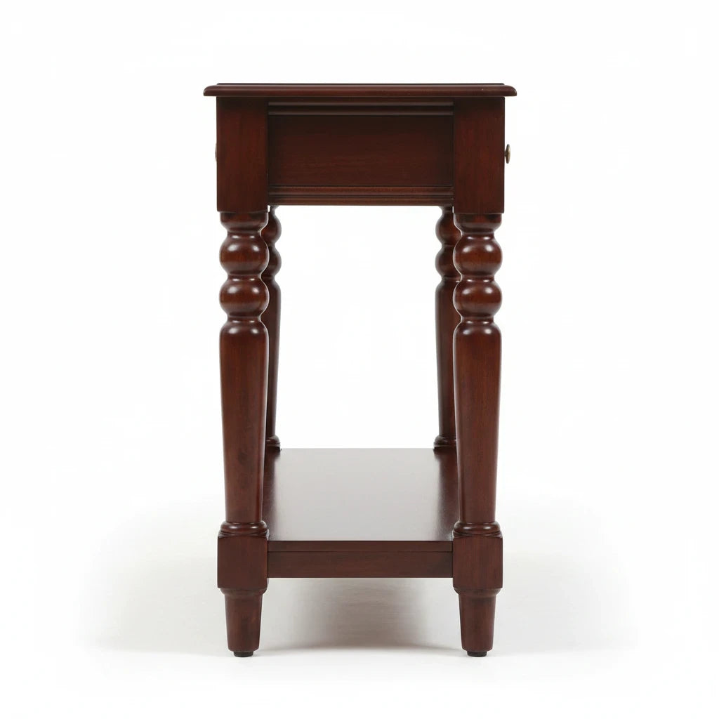WOOD CURLS Aurea solid Sheesham wood console table in honey oak finish, side view showing turned legs and lower shelf.