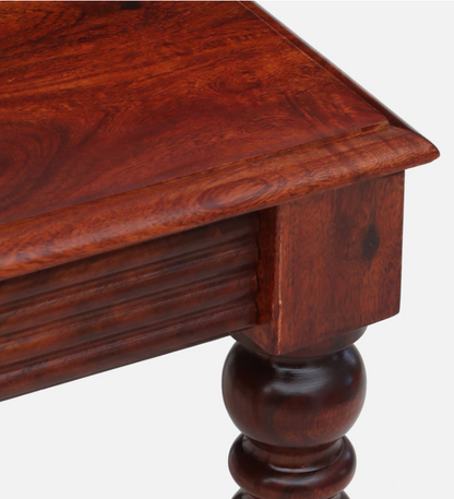 Close-up of a WOOD CURLS Oakridge end table in honey oak finish, showcasing the rich grain of solid Sheesham wood.