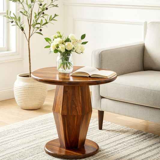 WOOD CURLS Armonia round sheesham wood coffee table with a geometric pedestal base and natural polished finish.