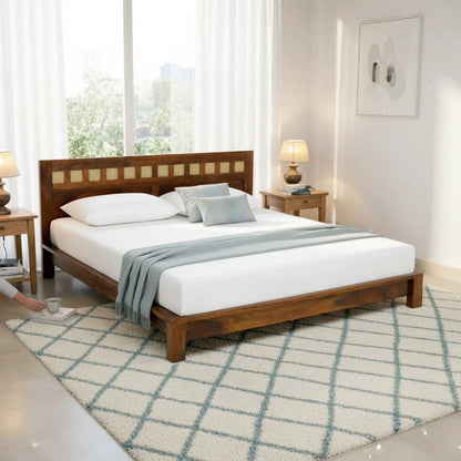 WOOD CURLS king size Sheesham wood bed with a cane headboard in a bright, modern bedroom setting.