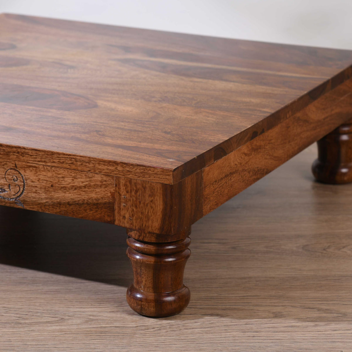 WOOD CURLS handcrafted Sheesham wood puja chowki with a polished surface and traditional carved legs for home temples.