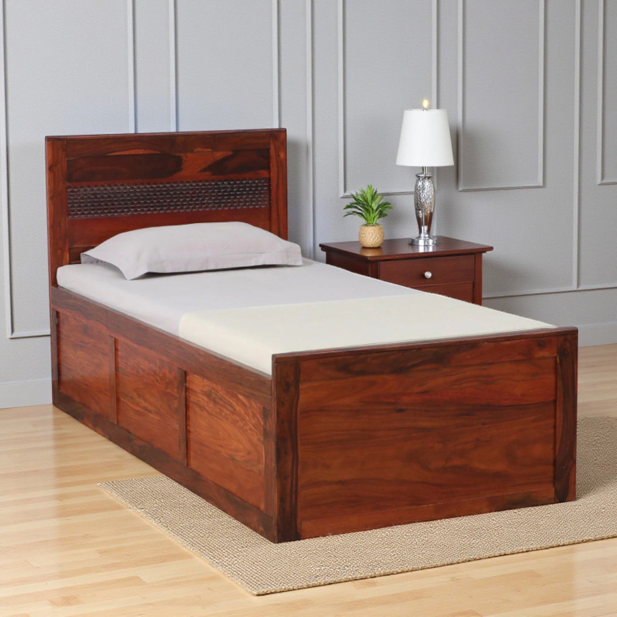 Sheesham wood single bed with box storage honey oak finish

Solid wood single bed with storage for bedroom

Honey oak finish wooden single bed frame

Storage compartment inside Sheesham wood bed