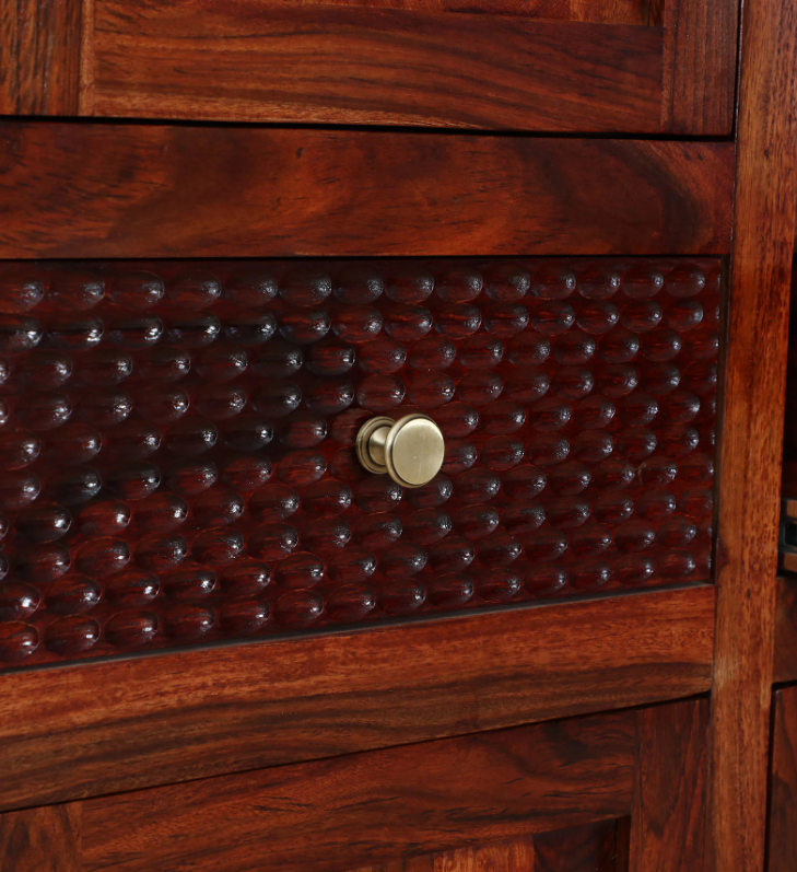 WOOD CURLS Natura wardrobe drawer featuring hand-carved textured wood detail and a round brass-finish knob.
