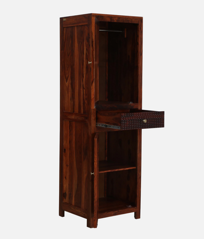 WOOD CURLS Elyssian one-door wardrobe in solid Sheesham wood with a honey oak finish, featuring an open drawer.