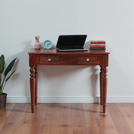 WOOD CURLS solid Sheesham wood writing table in honey oak finish with two drawers and elegant turned legs.