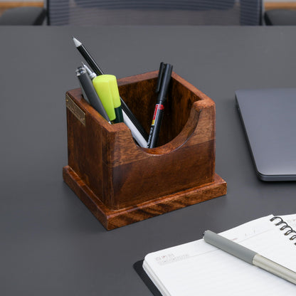 WOOD CURLS solid wood pencil holder on a dark desk with stationery, featuring a minimalist square design.