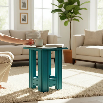 WOOD CURLS teal solid wood end table serving as a side table in a bright living room with a steaming mug on top