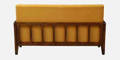 Yellow upholstered bench with wooden frame on a white background