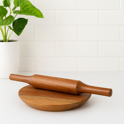 WOOD CURLS wooden chakla belan set with a 24 cm round rolling board and 32 cm rolling pin on a white kitchen counter.