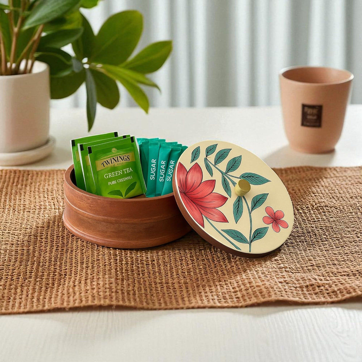 WOOD CURLS handcrafted mango wood storage container with a hand-painted floral lid holding green tea bags