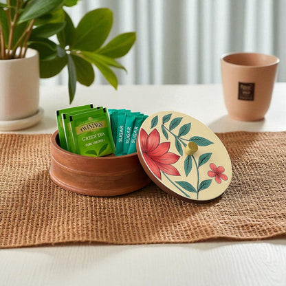 WOOD CURLS handcrafted mango wood storage container with a hand-painted floral lid holding green tea bags