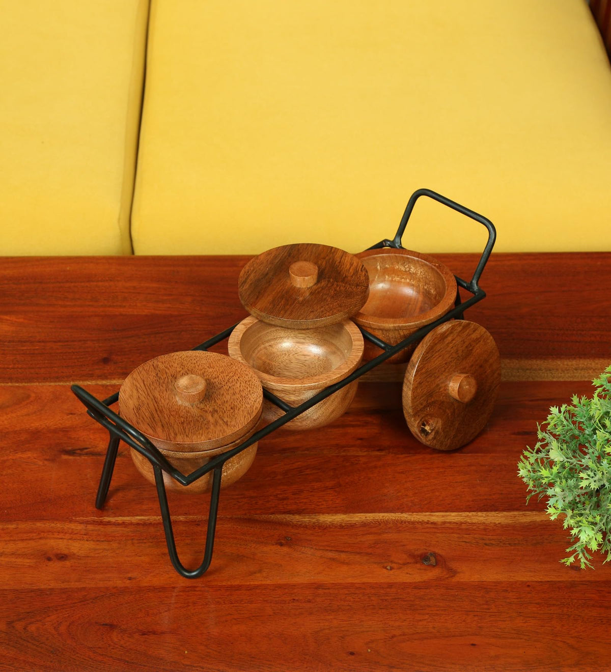 WOOD CURLS set of 3 solid wood serving bowls with lids and a black metal stand on a wooden table.