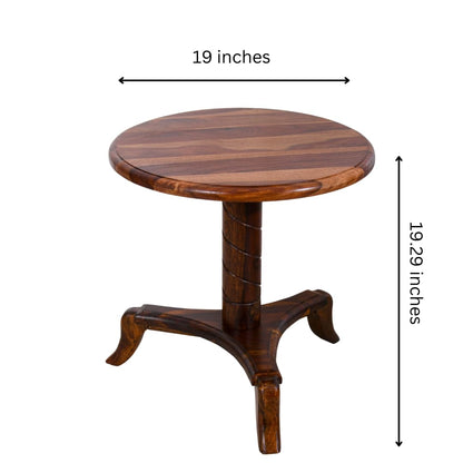 WOOD CURLS round end table made of premium Sheesham wood with a natural grain finish and a curved pedestal base.
